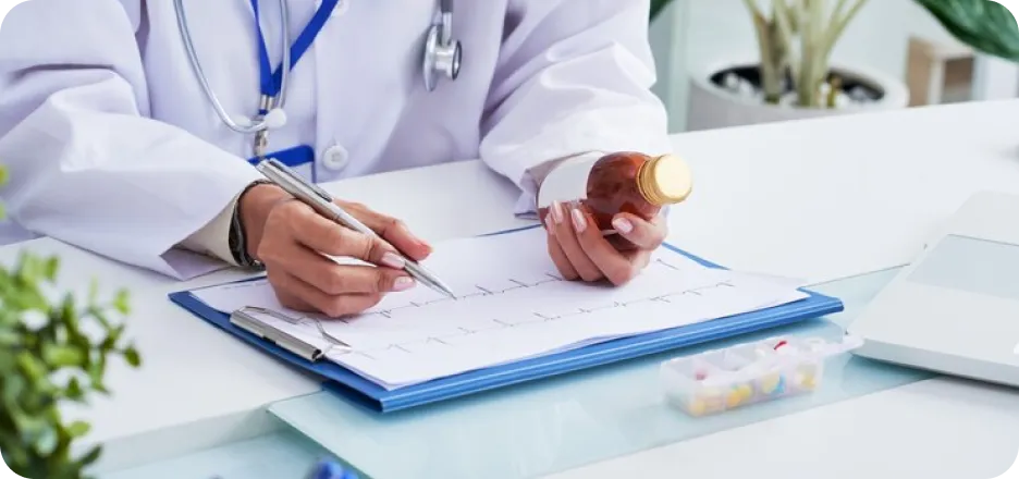 Physician writing a dosing plan
