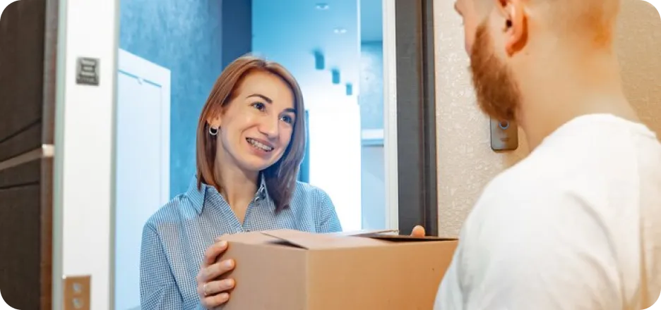 Woman receiving a medication package at her door